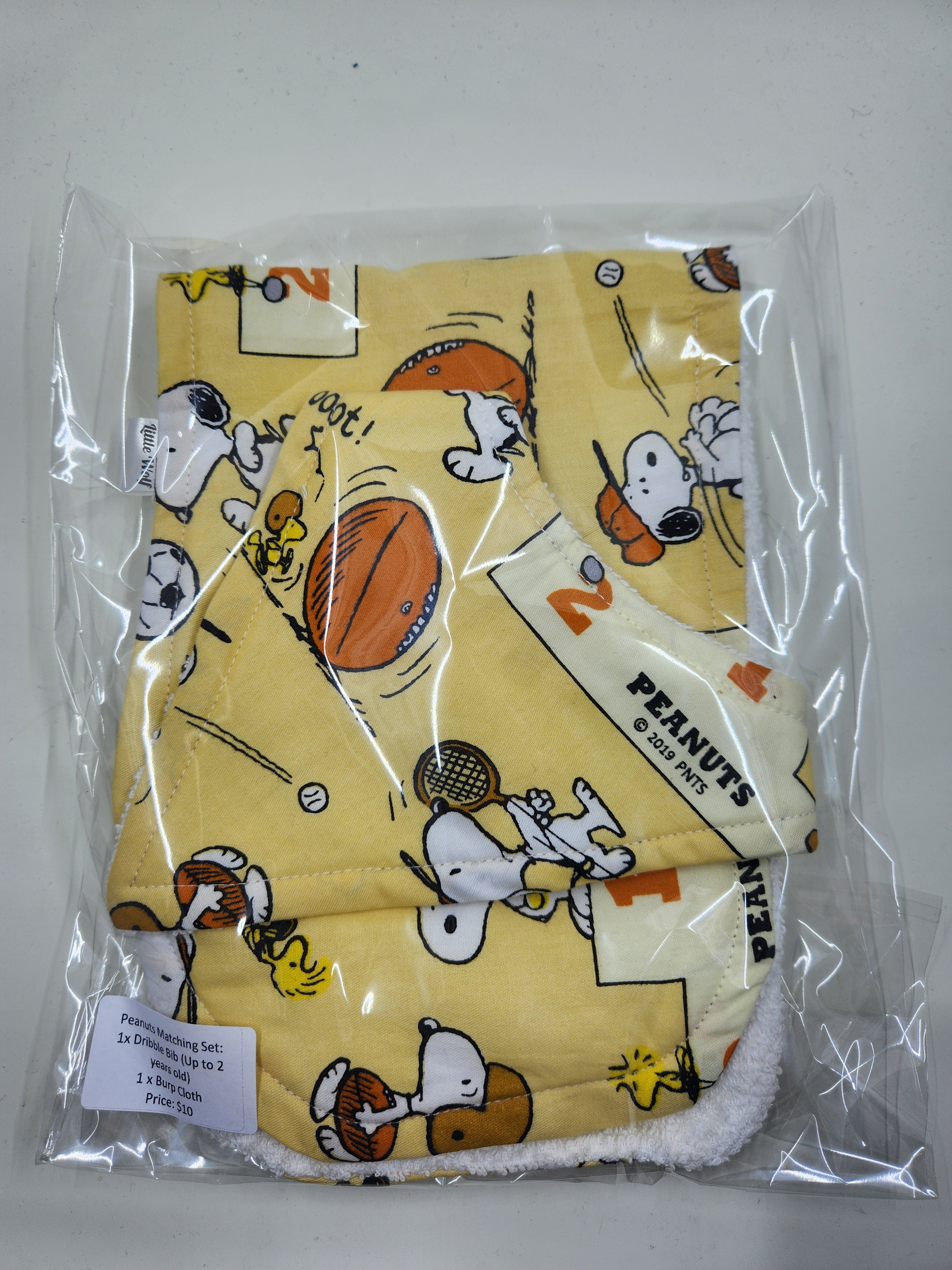 Peanuts  Bib + Burp Cloth Set